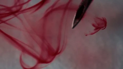 From the syringe needle Blood flows Stock Footage 70640938