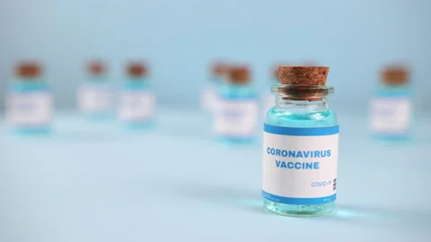 Syringe needle, a drop liquid, blurred pfizer company on the blue background. Stock-Footage 172393289