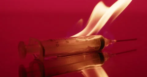 Syringe needle on fire, Red Abstract background. Vaccine, dangerous, biohazard Stock-Footage 150917552