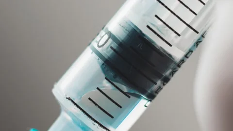 Syringe needle injection preparing for vaccination 07 (color graded) slow motion Stock Footage 150125613