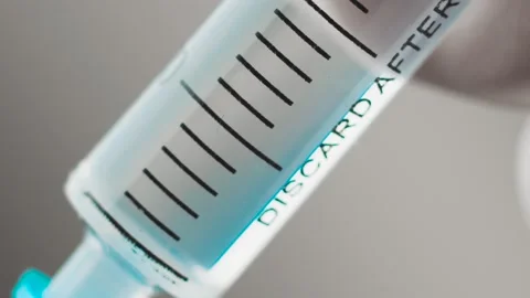 Syringe needle injection preparing for vaccination 08 (color graded) slow motion Stock Footage 150125654
