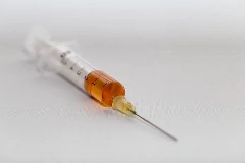 A syringe with a needle Stock Photos