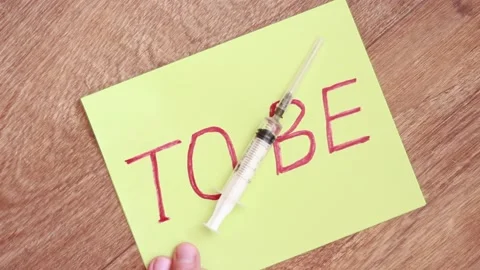 Syringe over memo TO BE Stock Footage 157355285