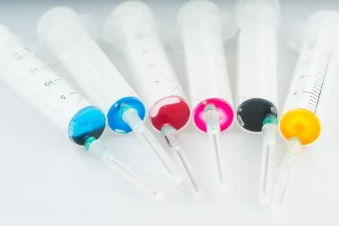 Syringe with paint Stock-Fotos