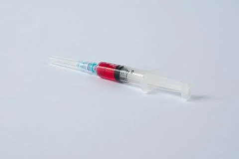 Syringe with red liquid Stock Photos