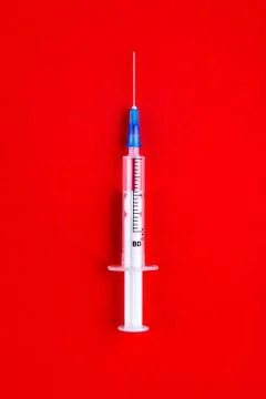 Syringe on the Red Stock Photos