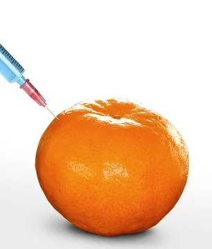 Syringe sticked into orange,GMO Stock Photos