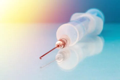 Syringe on the table close up in blur Stock Photos