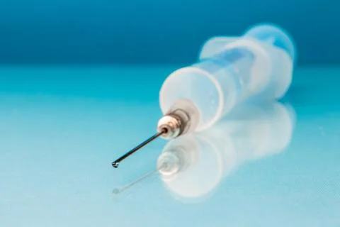 Syringe on the table close up in blur Stock Photos