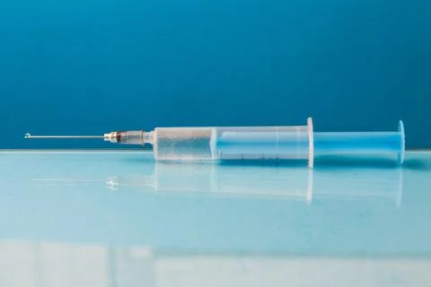 Syringe on the table Stock Photos