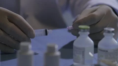 Syringe transferring fluids Stock Footage 20446422
