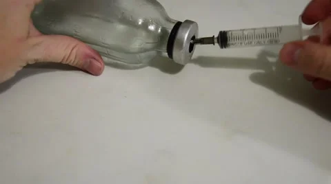 Syringe type medication from a transparent bottle Stock Footage 55073521