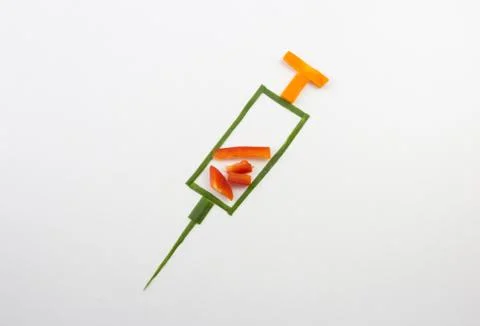 Syringe from vegetables Stock Photos