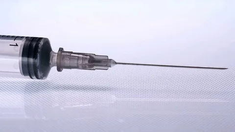 Syringe on white background Stock Footage 79391118