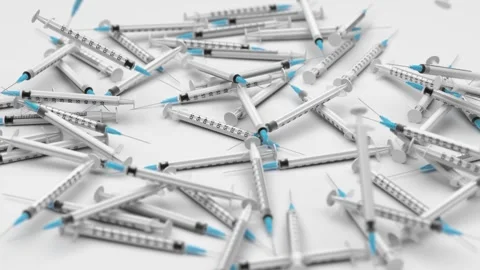 Syringes falling on white background Stock Footage 161088507