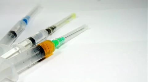 Syringes Filled With The Right Dose Of Medicine Isolated On White, Pan Stock Footage 47656209