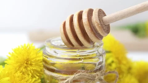 Syrup, dandelion honey, composition with fresh flowers Stock Footage 272230563