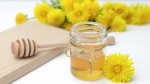 Syrup, dandelion honey, composition with fresh flowers Stock Footage 272230564