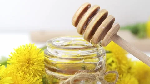 Syrup, dandelion honey, composition with fresh flowers Stock Footage 272230566