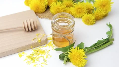 Syrup, dandelion honey, composition with fresh flowers Stock Footage 272230580