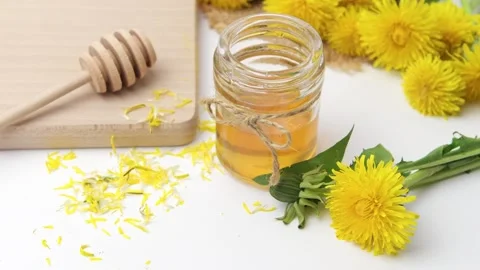 Syrup, dandelion honey, composition with fresh flowers Stock Footage 272230606