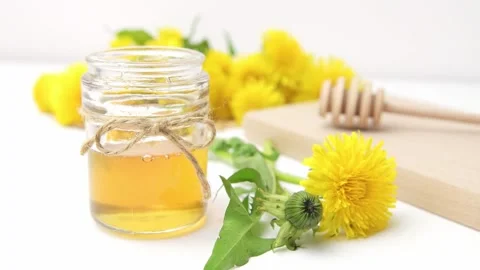 Syrup, dandelion honey, composition with fresh flowers Stock Footage 272230631