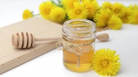 Syrup, dandelion honey, composition with fresh flowers Stock Footage 272230634