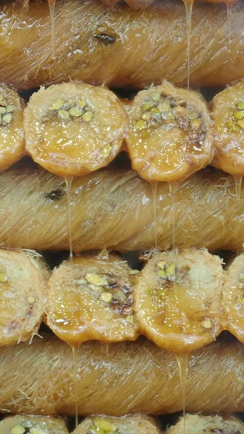 Syrup Drizzling Over Freshly Made Baklava Pastry Stock Footage 345546534