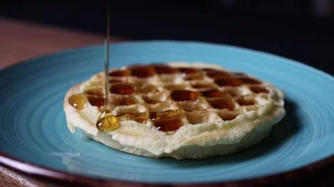 Syrup Drizzling on a Waffle Stock Footage 165706829