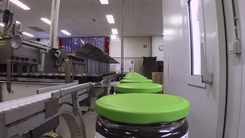 Syrup jars on a production line Stock Footage 82076712