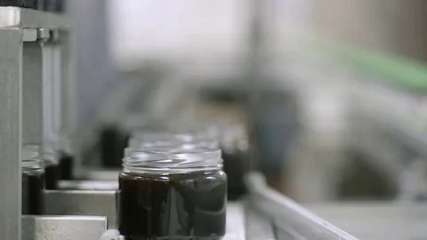 Syrup jars on a production line Stock Footage 82076783