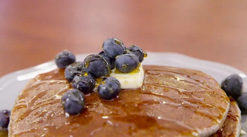 Syrup Poured Over Stack of Healthy Whole Wheat Pancakes &amp; Blueberries Breakfast Stock Footage 60205262