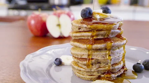 Syrup Poured Over Stack of Healthy Whole Wheat Pancakes &amp; Blueberries Breakfast Stock Footage 60205448