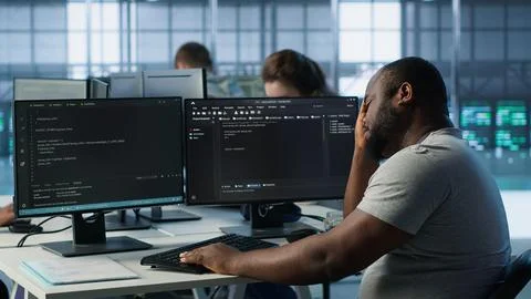 System admin feeling ill, having fever while working in data center Foto stock
