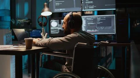 System admin using terminal window on laptop to program new code Photos