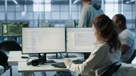 System admin working in diverse computer network security data center Stock Footage 319253542