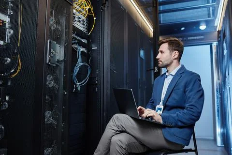 System Admin Working with Server Stock-Fotos