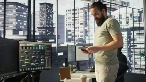 System administrator checking machine learning results on tablet Stock Footage 318228440