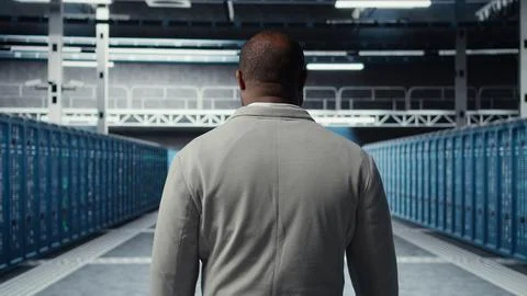 System administrator in data center doing inspection on infrastructure tech Stockfoto's