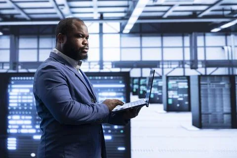 System administrator in data center implementing backup solutions Stock Photos