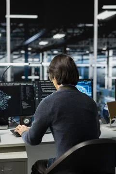 System administrator in data center optimizing hardware for AI tasks 写真素材