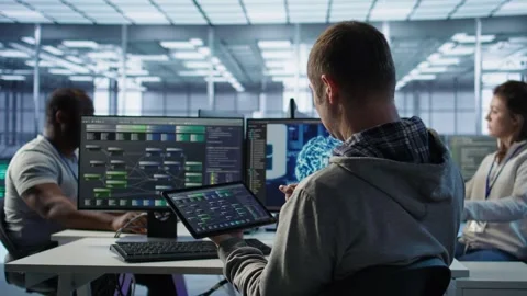 System administrator in data center solving tasks on tablet Stock Footage 319251287