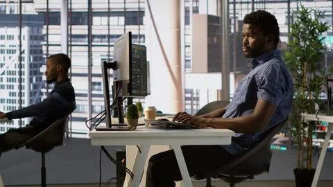 System administrator debugging company servers, preventing failures Foto stock