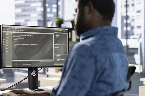 System administrator debugging company software Stock Photos