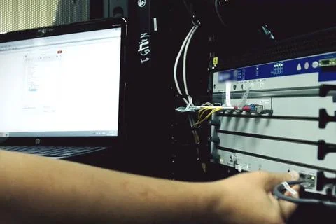 The system administrator is debugging server hardware. Arkhangelsk, Russia... Stock Photos