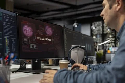 System administrator detecting and blocking hacker intrusion Stock-Fotos