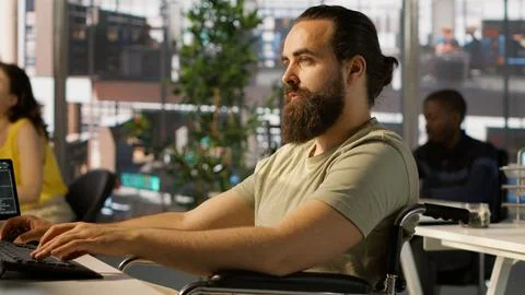 System administrator with disability training machine learning models Stock Photos