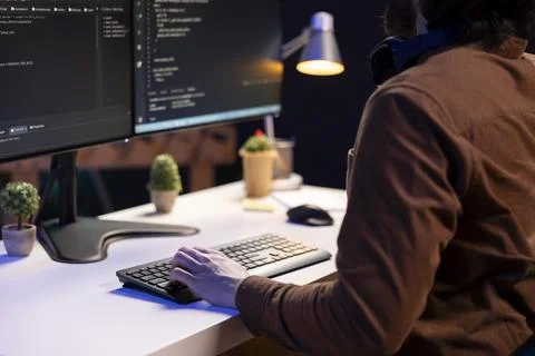 System administrator doing software debugging on PC at home, typing on keyboard Foto stock