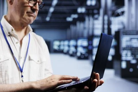 System administrator examining servers Foto stock