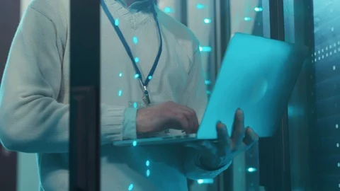 System administrator with laptop running maintenance checking network and data Stock Footage 119233287
